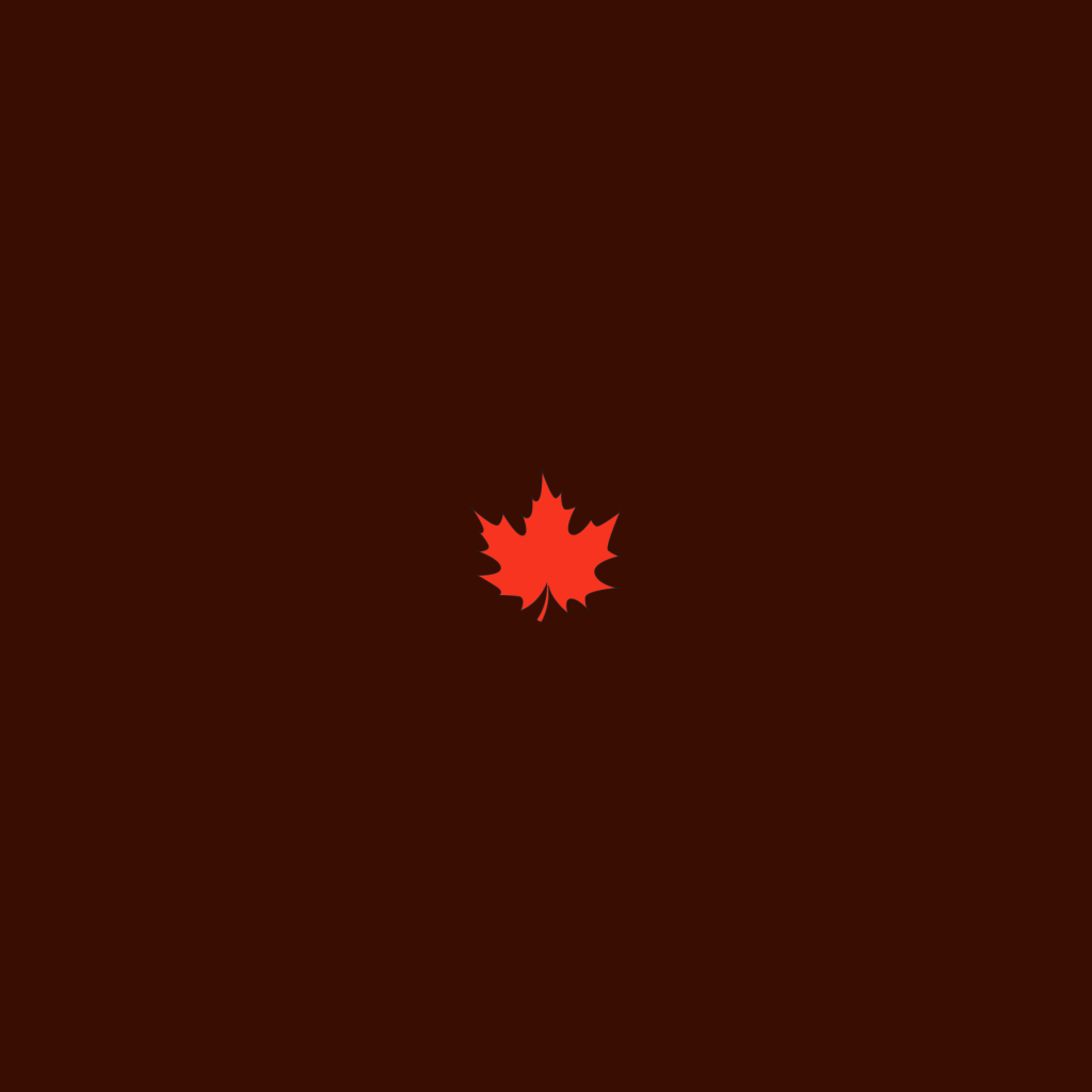 A single red maple leaf shape with a dark shadow glow around it sitting in the center of a blank white canvas. This is a great way to use a create seamless pattern script in Adobe Illustrator.